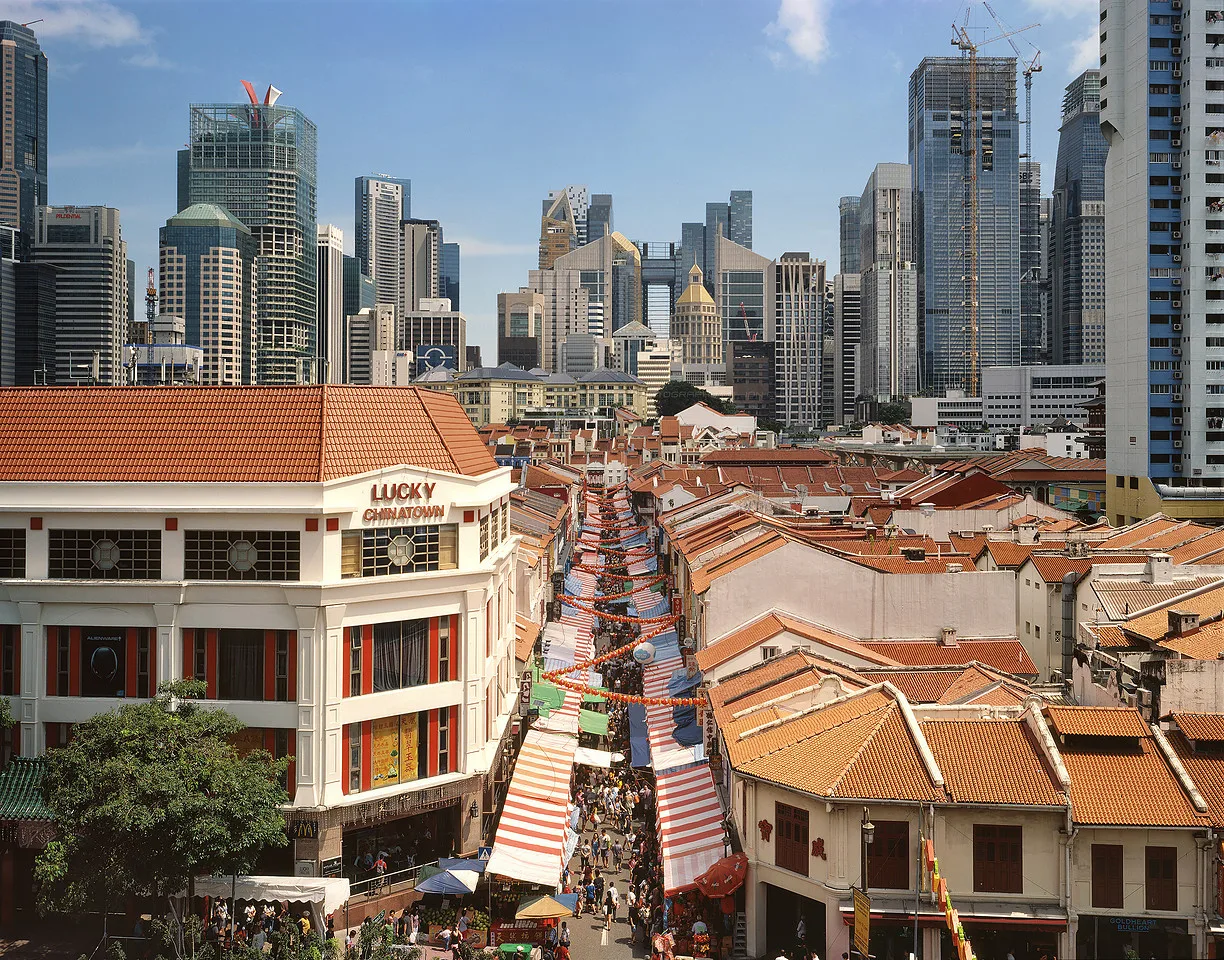 Two eras of the city stacked in one frame.