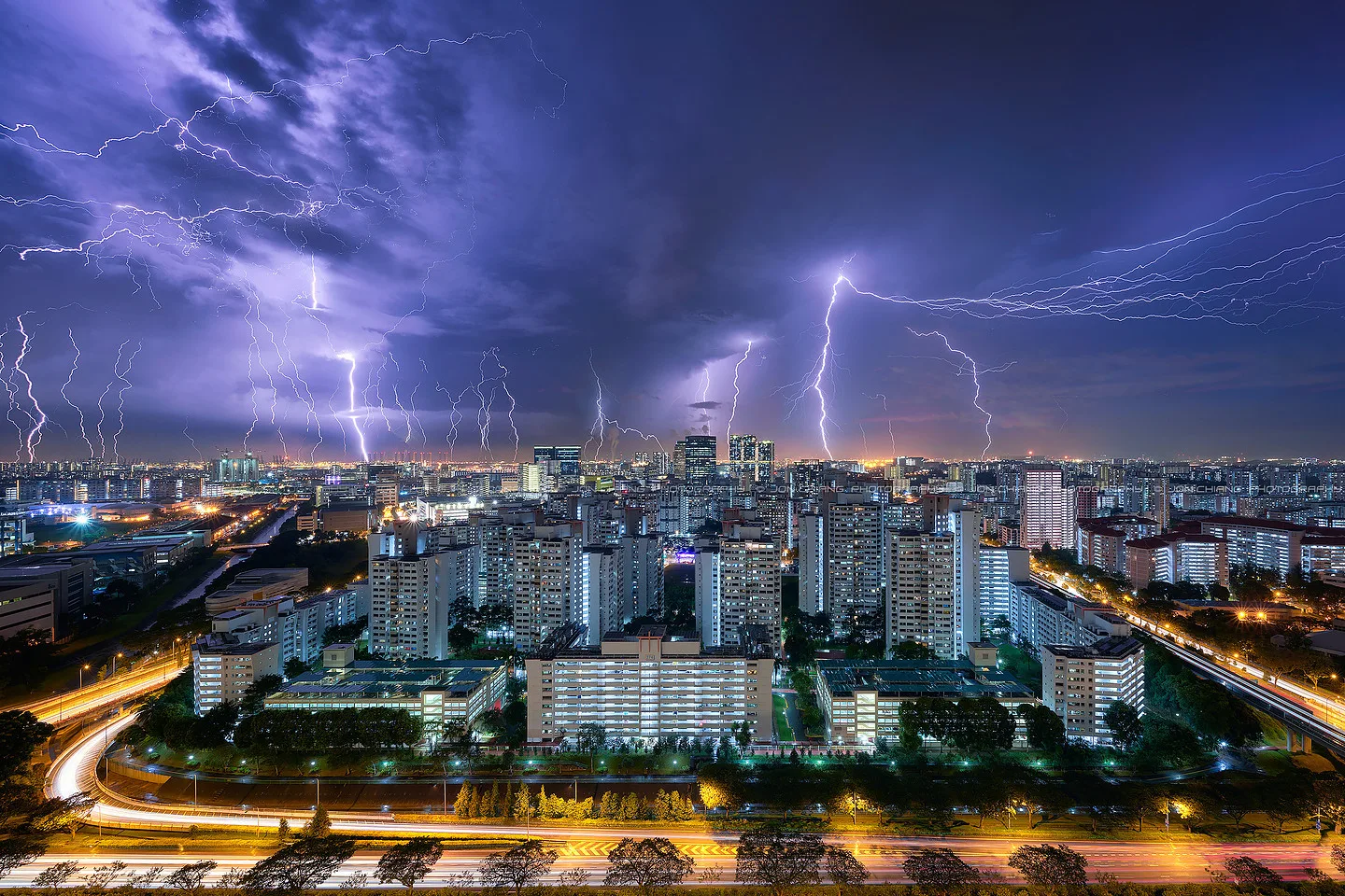 Lightning breaking over housing blocks - a long wait for a short moment.
