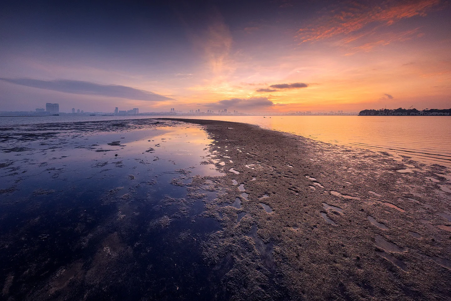 Low tide holding the last of the colour on a near-empty shore.